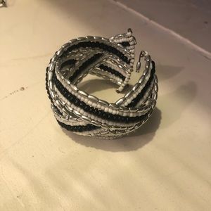 Bracelets - beaded, gold cuff, clear rock, feather